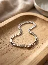 AI Generated Silver Curb Chain Bracelet Lifestyle Image